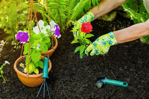 Worker wearing PPE during garden maintenance